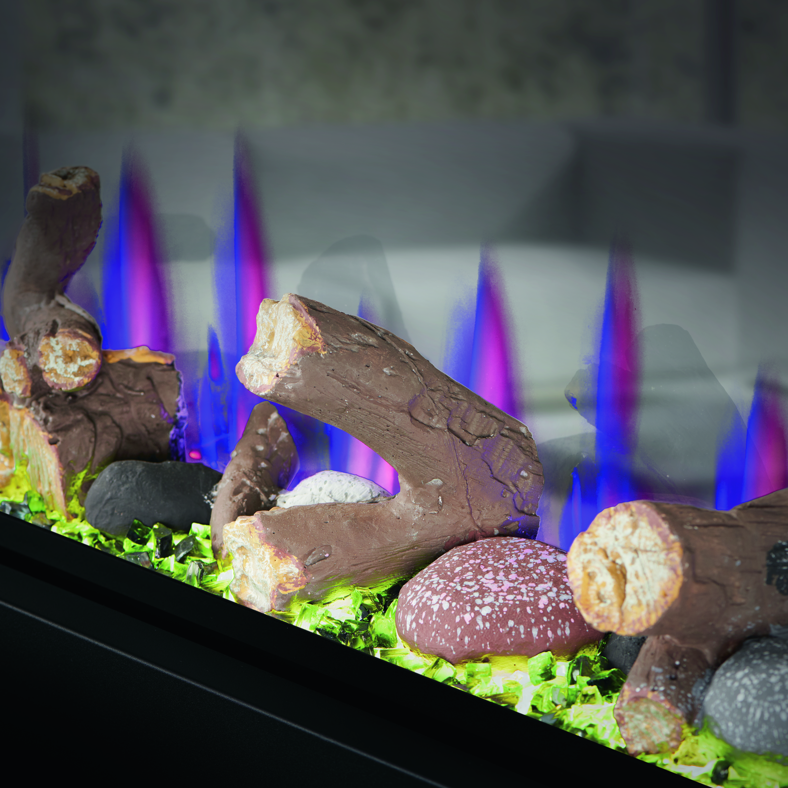 Decorative fireplace with logs and stones on a dark background