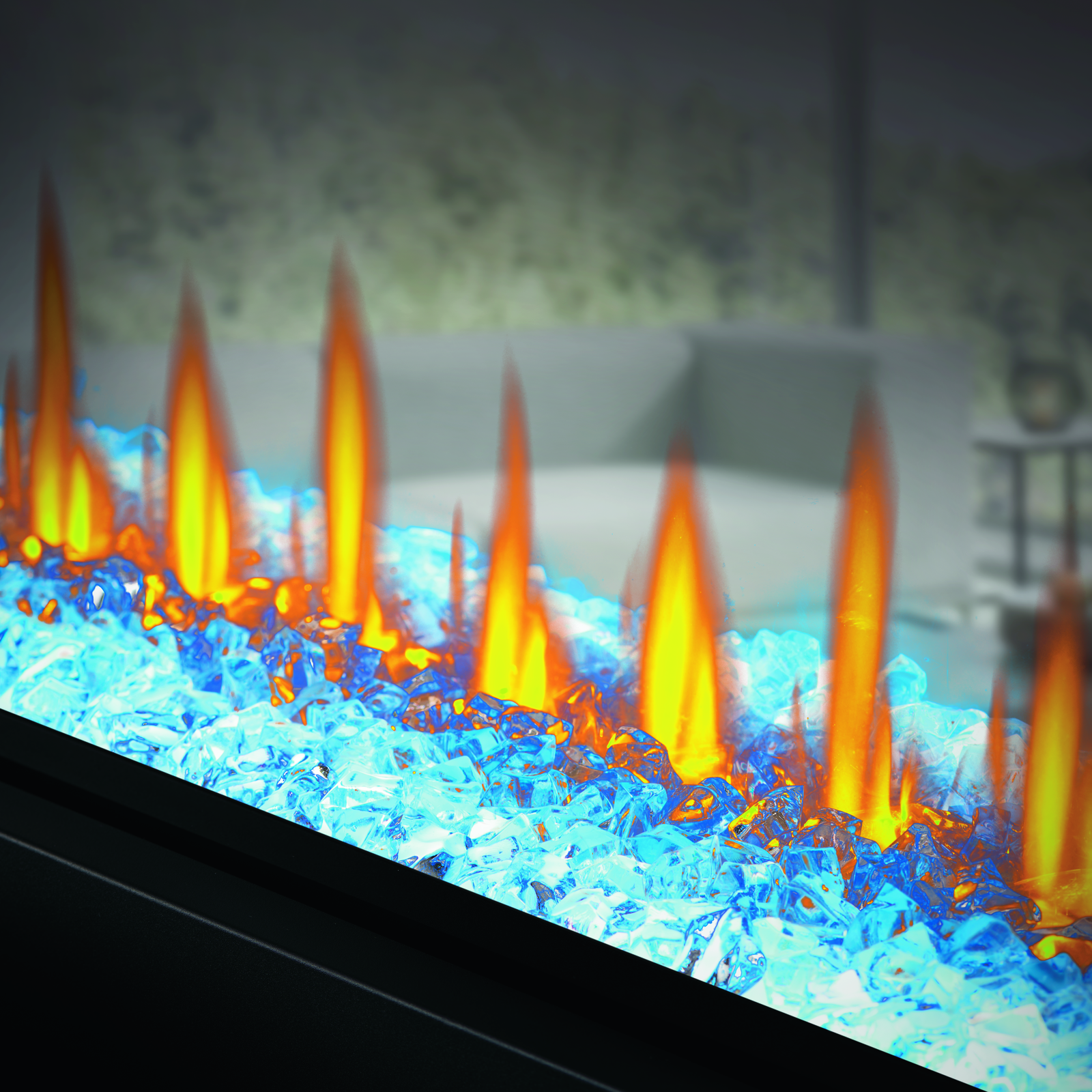 Close-up of a fire pit with blue and orange flames.