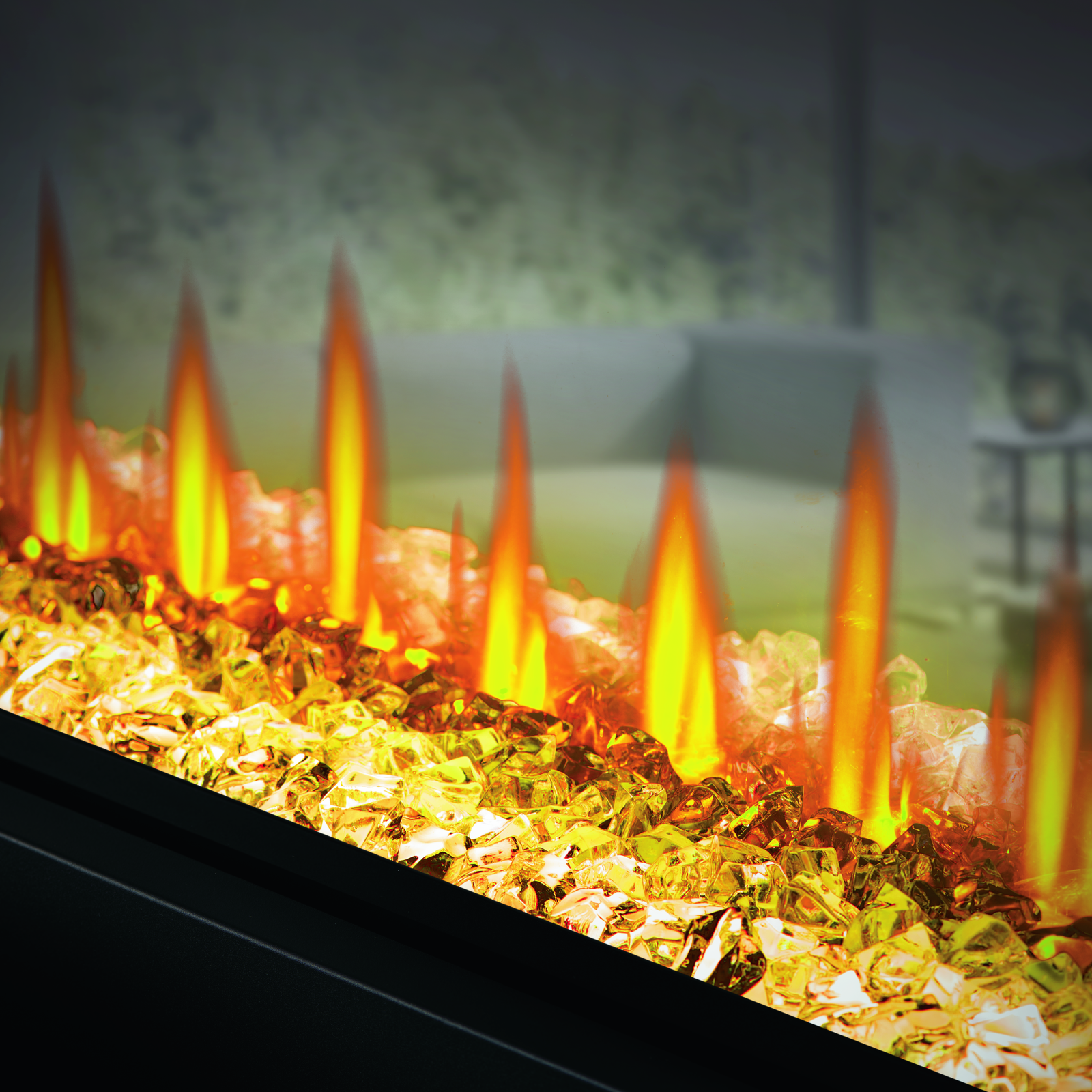 Close-up of a fireplace with glowing embers and flames.