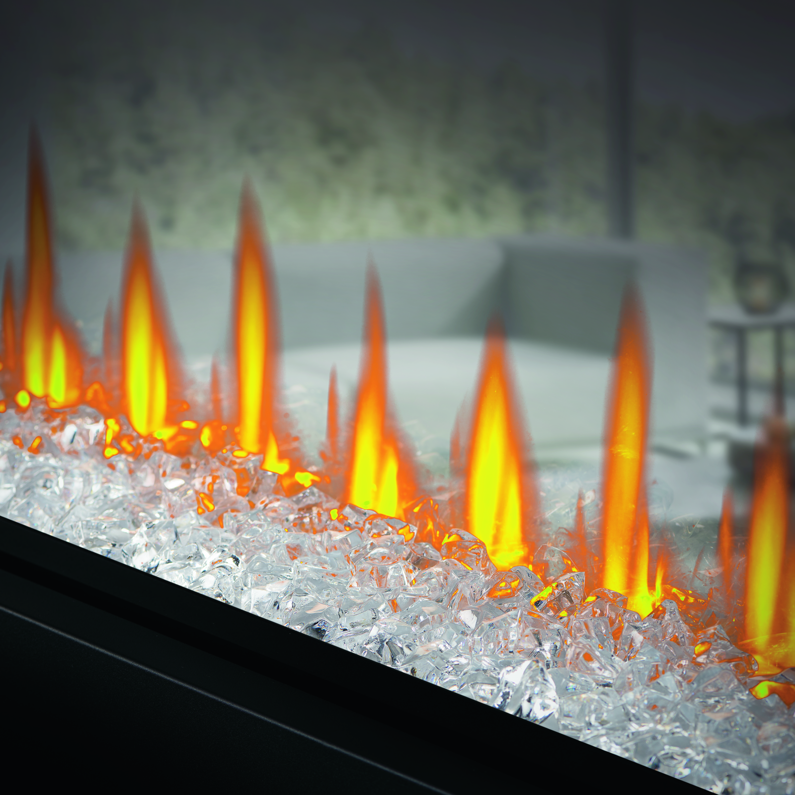 Artificial fireplace with glowing flames and glass beads in a room setting.