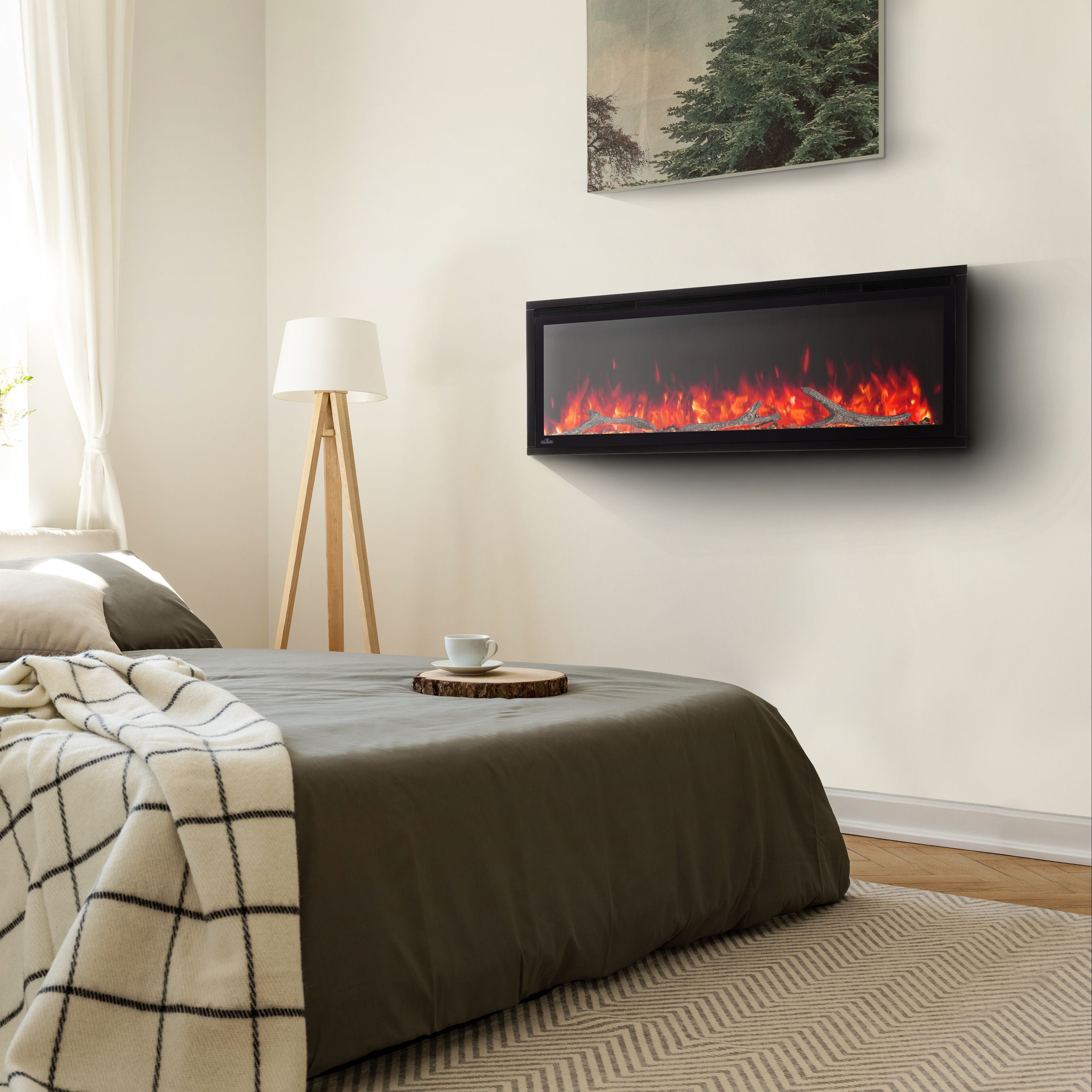 Modern bedroom with a bed, lamp, and wall-mounted electric fireplace.