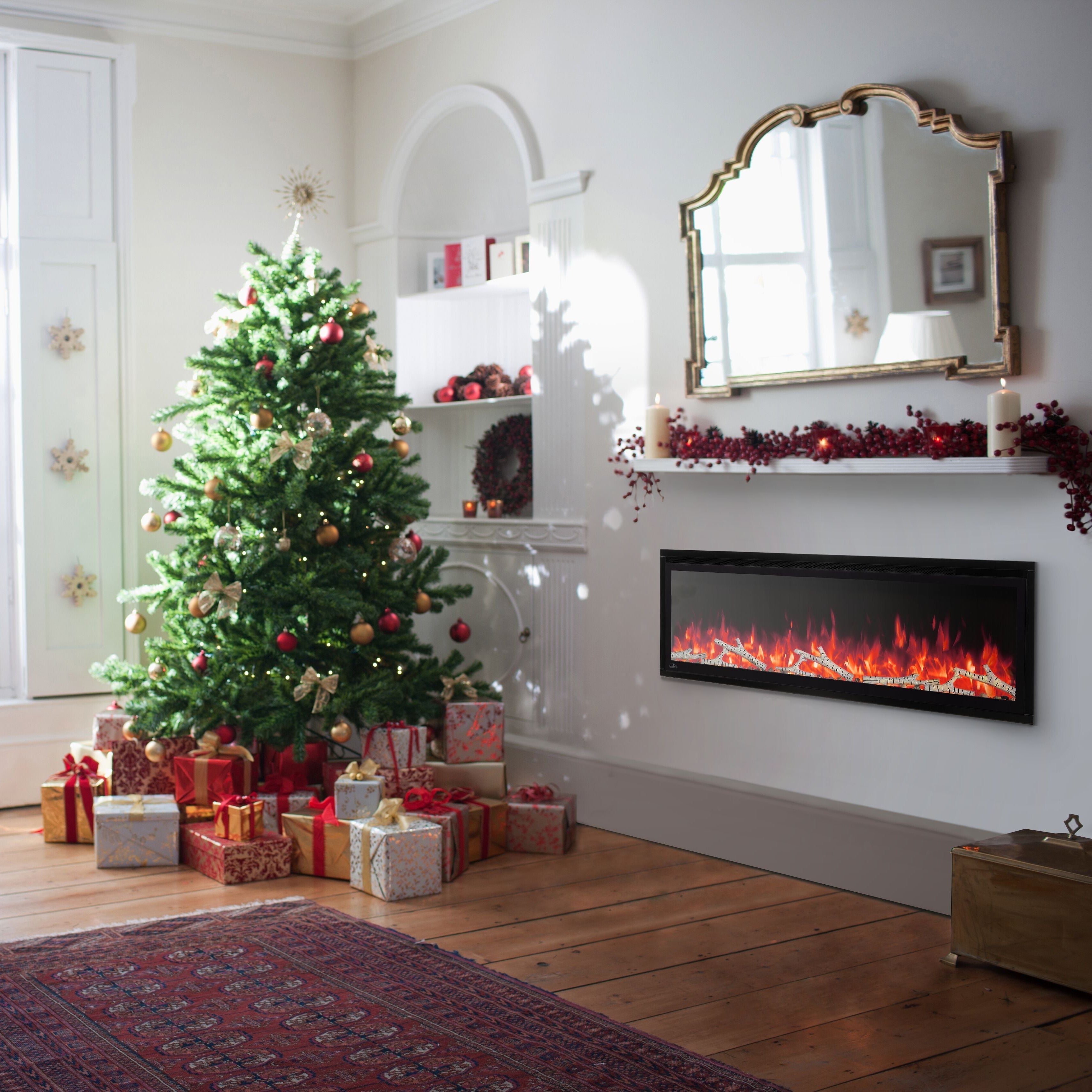 Living room decorated for Christmas with a tree, presents, and a fireplace.