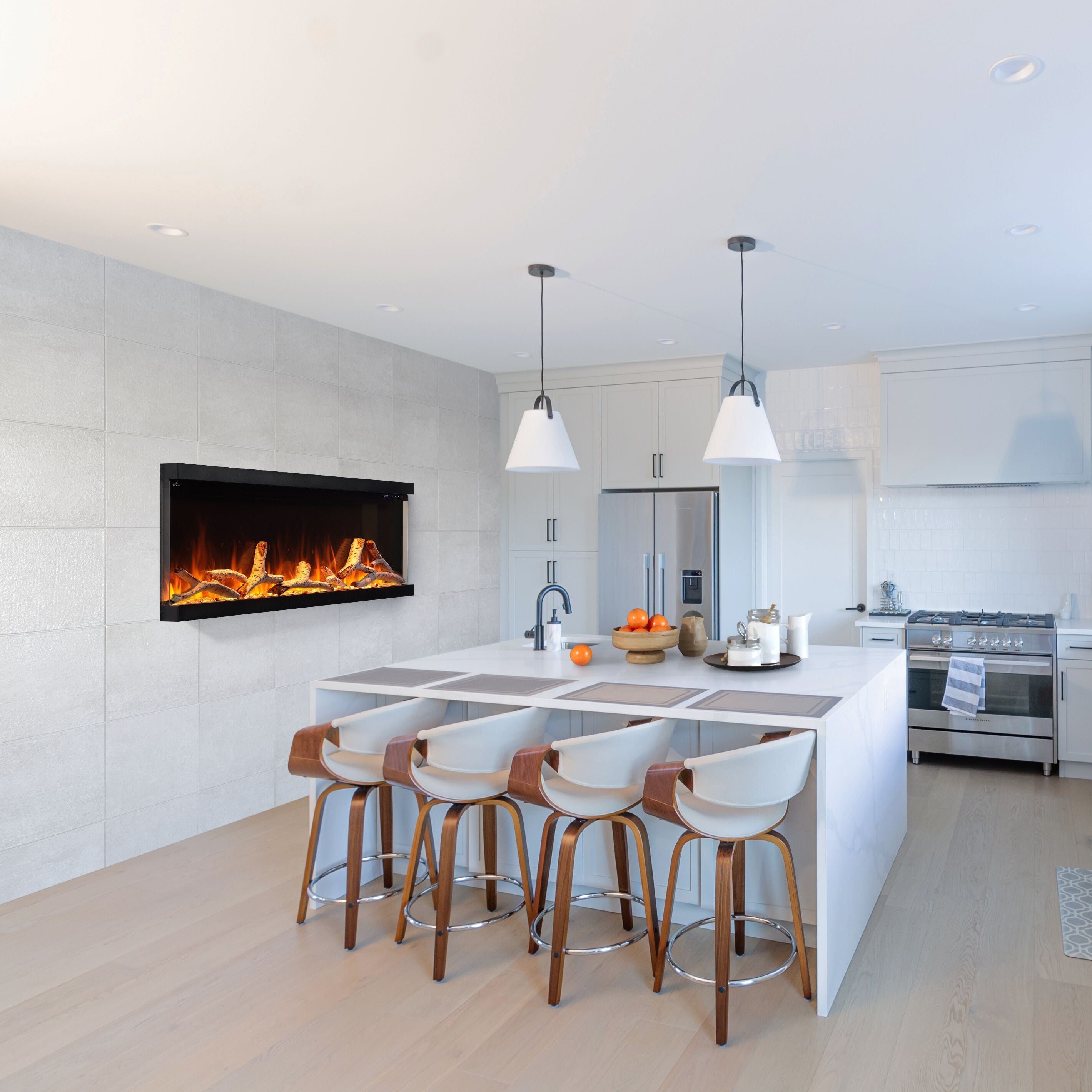 Modern kitchen with white countertops, wooden stools, and a fireplace.